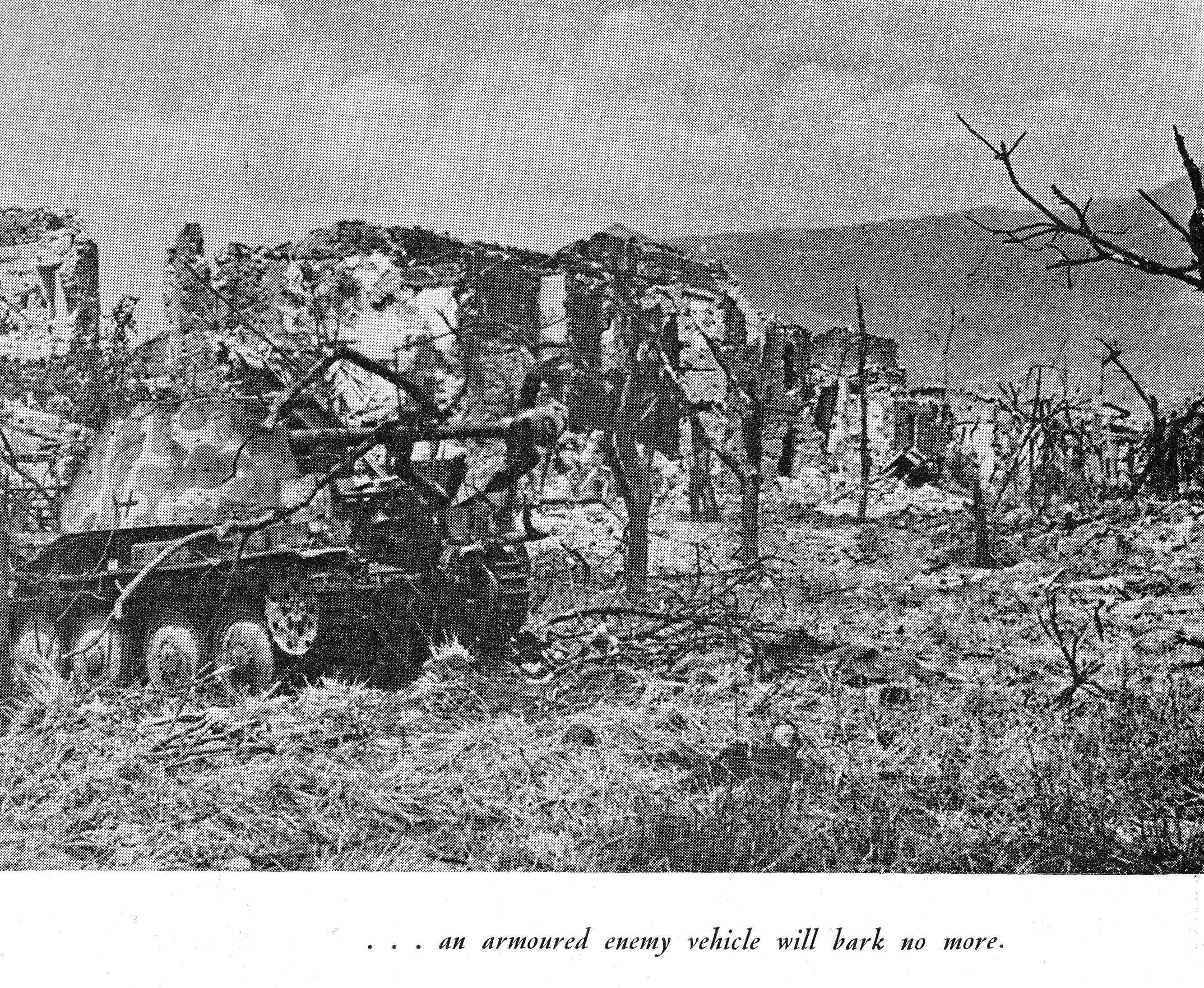 destroyed German tank in front of ruined buildings in Italy