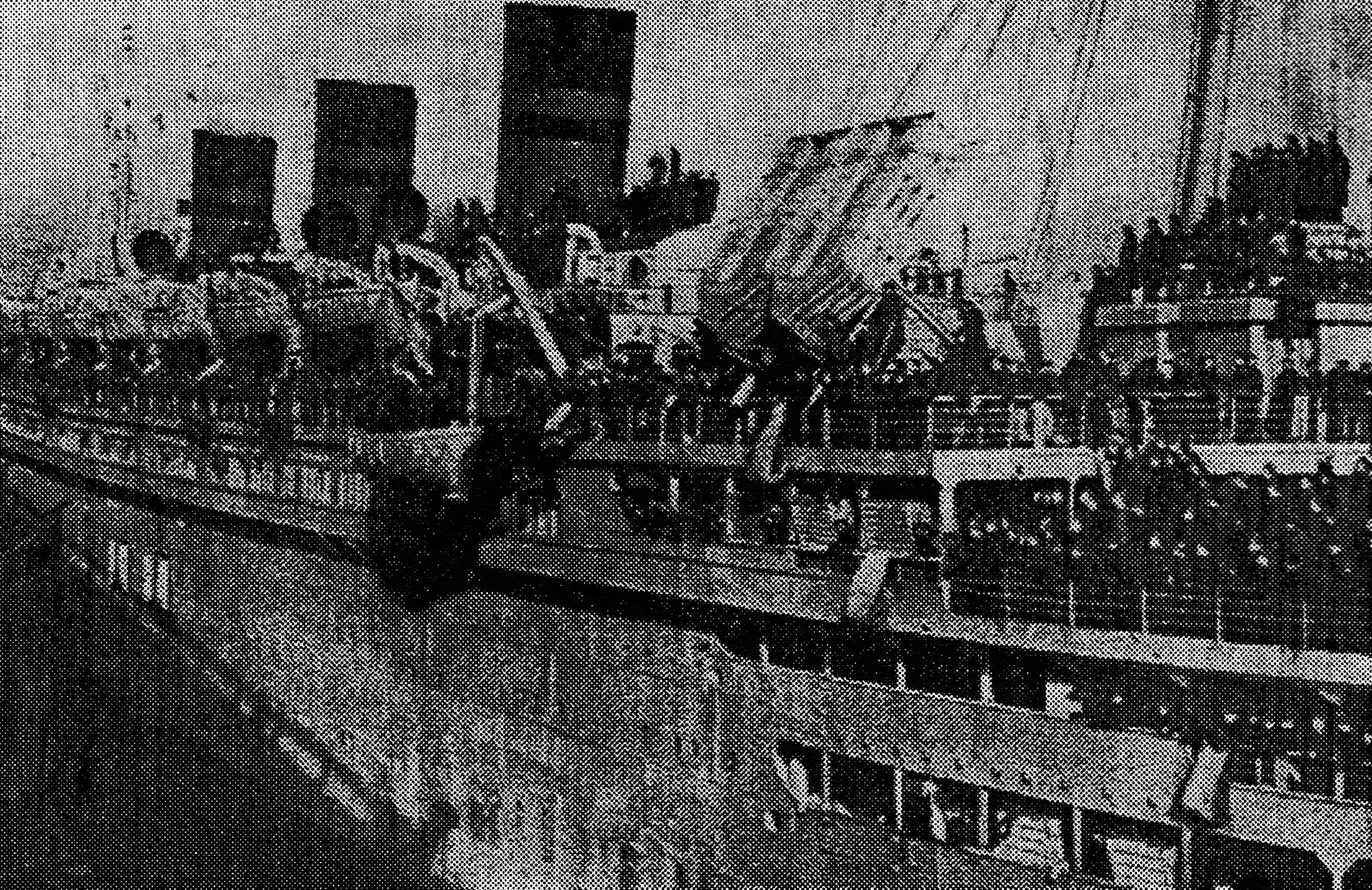 photo of a passenger liner with three smoke stacks and many soldiers on the decks