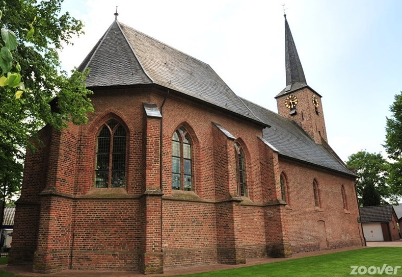Modern photograph of the old church in Otterlo showing the repaired spire